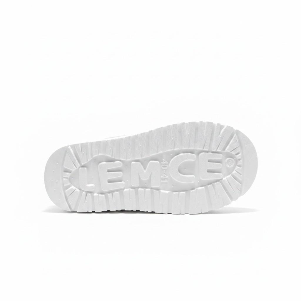 LEMCE Cloudstep Plush Slipper white rubber outsole close-up showing ribbed grip texture and embossed logo
