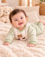 LEMCE Meadow Bear cream green textured cotton baby suit on smiling infant full body view